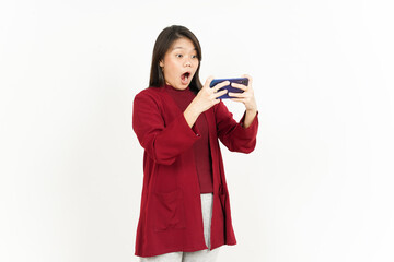 Playing Mobile Game On Smartphone Of Beautiful Asian Woman Wearing Red Shirt Isolated On White