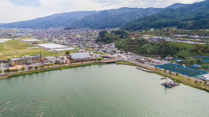 Fototapeta na wymiar Drone shot of Lake Suwa & Kiso Mountains. Nagano Japan