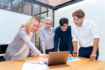 Team of Asian people with different age group brainstorming on data and information analysis for strategy management with senior woman leader for education and business concept