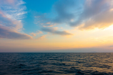 Naklejka na ściany i meble Beautiful sky sunset on the sea view in summer time.