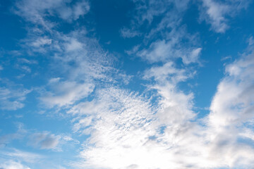 Tropical summer blue sky fluffy white cloud summertime on light sunny day cloudscape. Clear bright blue skyline spring sunlight climate background. Heaven blue environment ecology high scenic nature.
