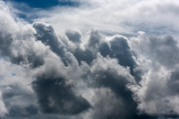 Dramatic dark storm rain clouds black sky background. Dark thunderstorm clouds rainny atmosphere. Meteorology danger windstorm disasters climate. Dark cloudscape storm disaster gloomy gray cloud sky