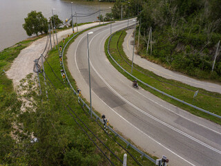 Aerial drone view of a paved country road in Bukit Merah, Perak, Malaysia.