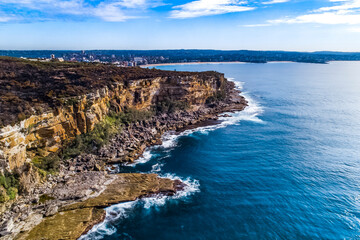 Stylized Long Exposure Drone Shot of Shelly Headland Waves