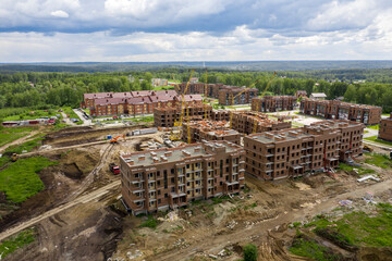 Aerial view of a condominium under construction in the forest in Siberia