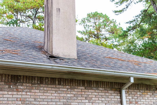Roof needing repair from damage caused by water leak.