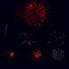 set of red fireworks on dark bg