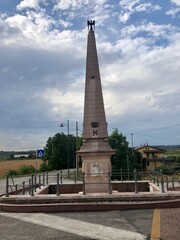 Fototapeta na wymiar Napoleonic obelisk commemorating the Battle of Arcole in Italy