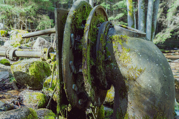 The mechanisms of the old mill on the stream. 