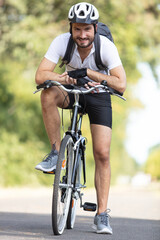 Obraz premium sporty cyclist rides a bicycle on the road