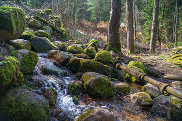 The mechanisms of the old mill on the stream. 