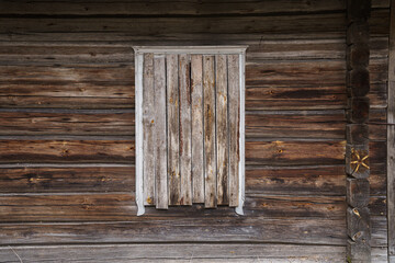 Window in an old wooden house. 