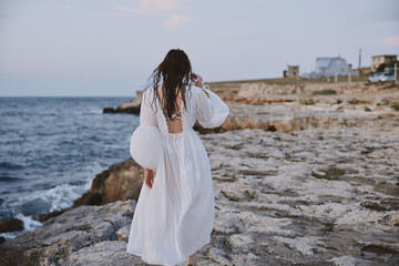 woman outdoors summer lifestyle beach landscape rocks