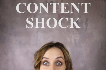 Surprised young woman and the inscription Content Shock
