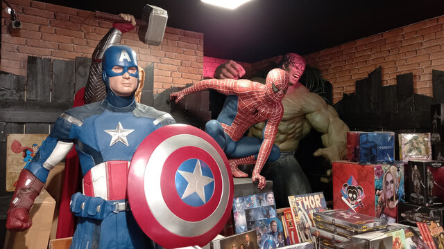 spiderman Hulk and Captain America character giant figurine toy sculpture portrait of Marvel Legends Incredible in book shop