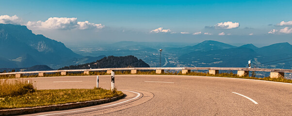 Fototapeta premium Beautiful alpine summer view with the city of Salzburg in the background at the famous Rossfeldstrasse panorama street, Bavaria, Germany