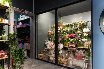 stylish flower shop interior with potted plants and fridge for premium bouquets