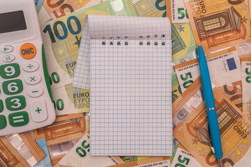 empty notepad memo with pen on euro money