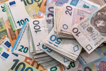 Obraz na płótnie Canvas pln polish money and euro bills as finance background