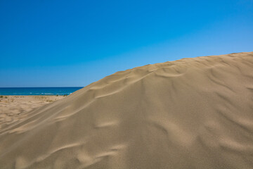 Beach. Dune in the beach with clear sky and sea on background