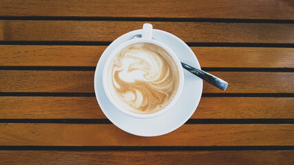 Cup of coffee on a wooden table