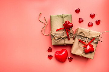 Valentine's day greeting card with different gift boxes and heart on pink background.