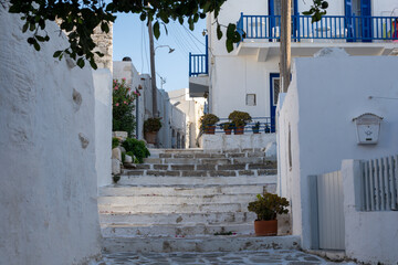 Traditional white houses in a street of the old town of Parikia in Paros, Greece