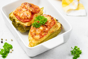 stuffed bell peppers in baking dish. Copy space.