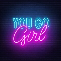 You go girl neon lettering on brick wall background.