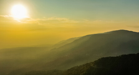 The sun set on the plain land of Bangladesh as seen from Himalayas of India