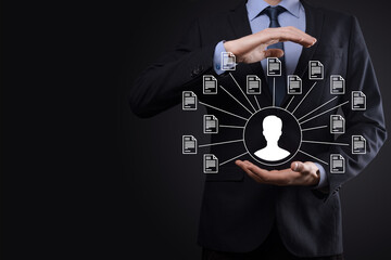 Naklejka premium Document Management System DMS .Businessman hold user and document icon.Software for archiving, searching and managing corporate files and information.Internet Technology Concept.Digital security.