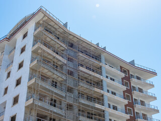 Multi-storey residential building under construction on a sunny day