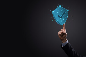 Businessman hold low poly polygon shield with a tick icon.Secure Access System Concept.Business...