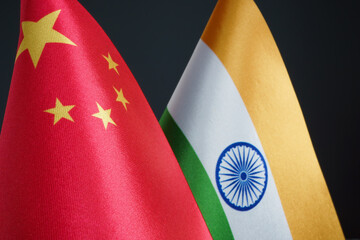 Flags of China and India in the dark.