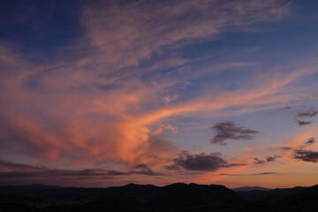 Sunset in the mountains, beautiful clouds.