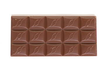bar of milk chocolate close up on white isolated background