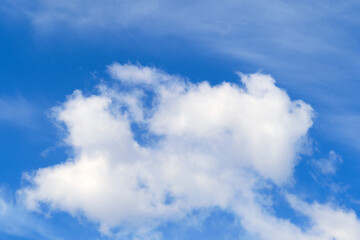 Naklejka na ściany i meble Cloudy sky background, warm sunny day
