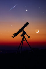 Silhouette of telescope and countryside under the starry skies.