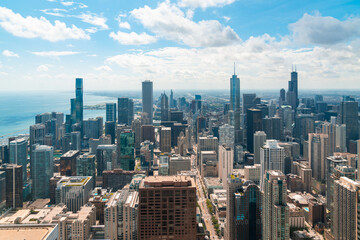 Obraz premium Aerial panoramic city view of Chicago downtown area at day time, Illinois, USA. Bird's eye view of skyscrapers at financial district, skyline. A vibrant business neighborhood.