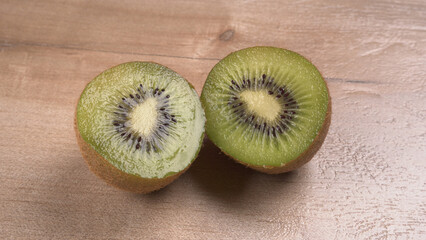 Kiwi fruit on wooden background with copy space. Concept of Healthy food. Tropical fruit.