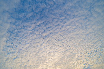 Sunset sky. Abstract nature background. Dramatic blue with orange colorful clouds in twilight time.