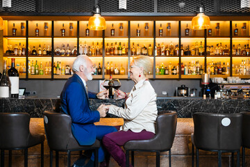 Couple in love toasting in a bar
