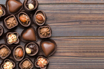 Different kinds of chocolates on colored table close-up. Top View and Flat Lay with copy space