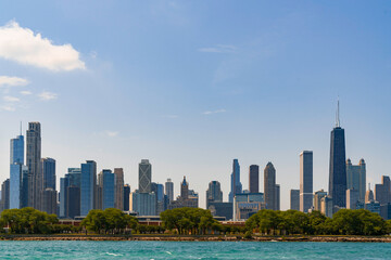 Fototapeta premium A picturesque view of Downtown skyscrapers of Chicago skyline panorama over Lake Michigan at daytime, Chicago, Illinois, USA