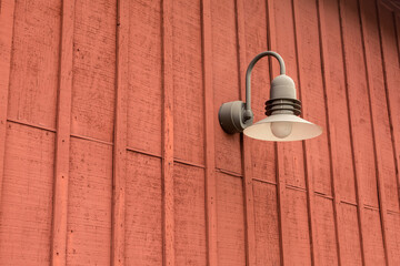 Barn light on a warehouse wall