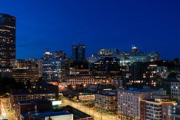 Illuminated aerial cityscape of Seattle, downtown at night time, Washington, USA.