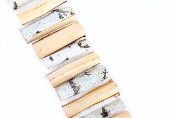 Firewood isolated on white background. Line of wood birch logs, bonfire. Closeup, top view
