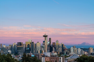 Fototapeta na wymiar Seattle skyline panorama with iconic view observation tower called Space Needle as seen from Kerry Park. Skyscrapers of financial downtown at sunset, Washington, USA. A vibrant business neighborhood