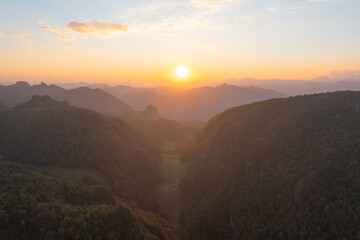 Aerial top view of forest trees and green mountain hills. Nature landscape background, Thailand.