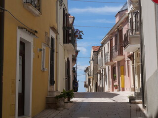 typical street with colorful buildings of the historic center inside the Swabian Castle in Termoli
